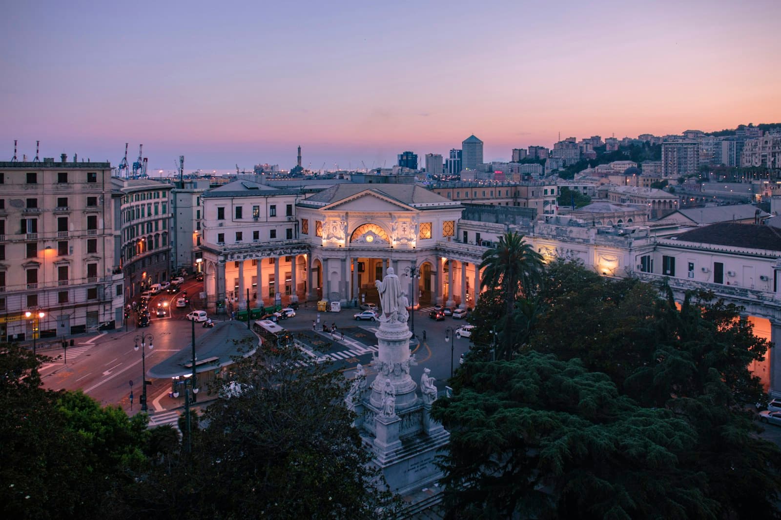 Aerial dusk view of Genoa's cityscape along the Ligurian coast