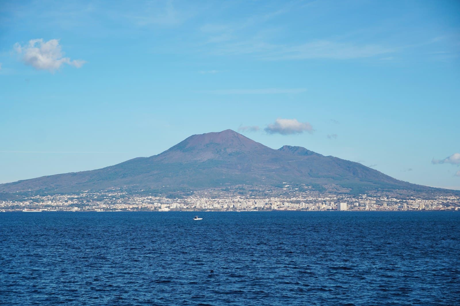 Naples' bay and skyline with Mount Vesuvius rising behind the city