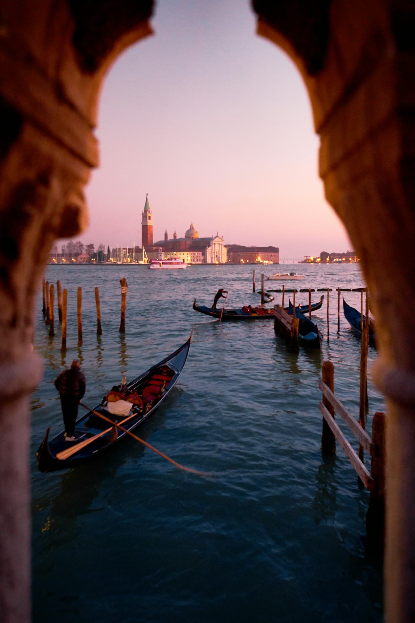 Venice's Grand Canal at sunset, lined with historic waterfront buildings